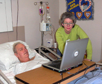 Lucinda and Tull check out the website (3/03)