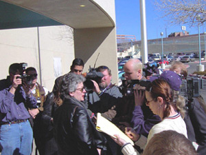 Lucinda talks to the press the day we arrive back in New Mexico (2/10/03)
